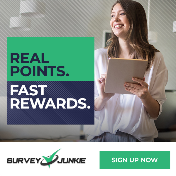 Survey Junkie Banner Ad \Opens on the Survey Junkie Sign Uo page Shows a smiling young woman seated on a couch with her  feet tucked up under her and a laptop on her lap .Text reads:Real Points Fast Rewards Survey Junkie Sign Up Now